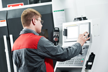 worker at machining tool workshop