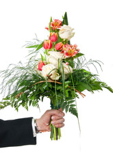 Bouquet with roses and tulips in man's hand over white