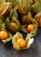yellow organic physalis on a wooden board