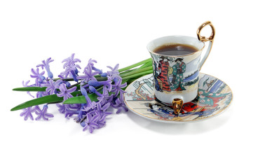 a cup of coffee with flowers