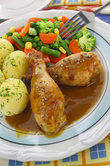 Chicken leg with vegetables and sauce