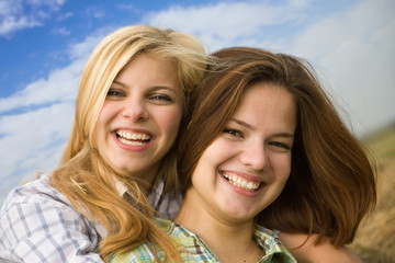Fototapeta premium Two happy girls together