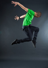 Fototapeta na wymiar dancer makes a difficult jump