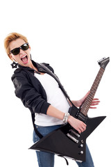 woman screaming while playing an electric guitar