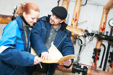 heating engineers in boiler room