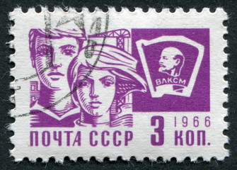 Postage stamp USSR 1966: A man and a woman and Komsomol sign