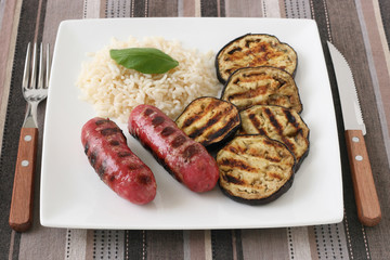 Grilled sausages with boiled rice