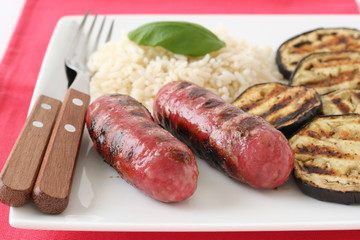 Grilled sausages with boiled rice