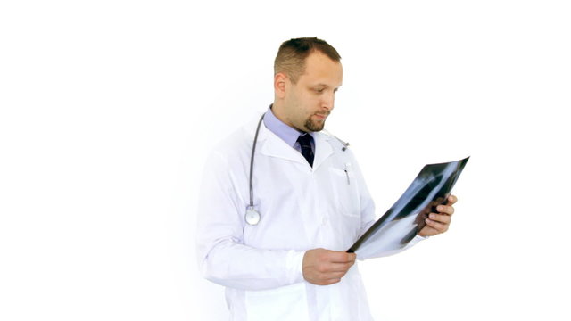 Male doctor looking at xray of human lungs, isolated on white