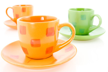 three coffee cups over a white background