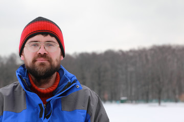 Portrait of man spectacled in winter