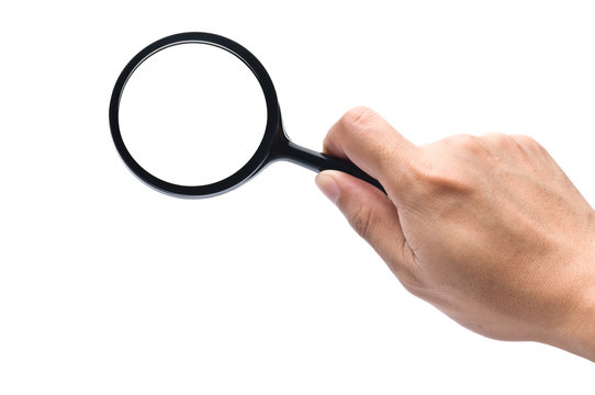 hand holds a magnifying glass with clipping paths