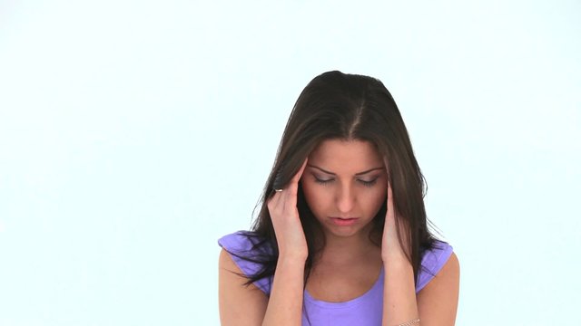 Young woman having a headache on the morning