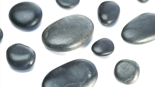 Black pebbles turning on themselves