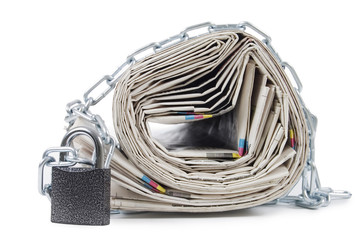 pile of newspapers with chains