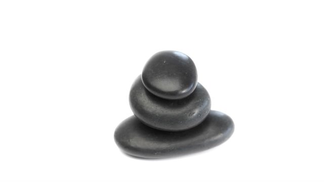 Black pebbles turning on themselves