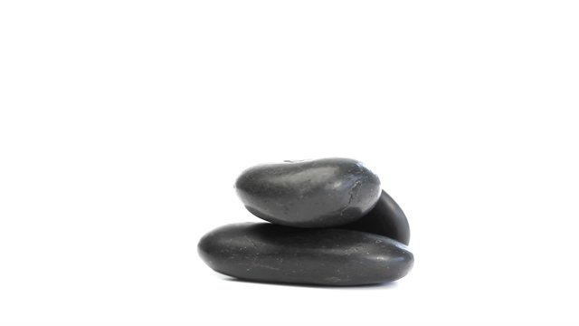 Black pebbles turning on themselves
