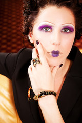 Obraz premium Portrait of beautiful young brunette woman with bright make-up