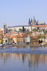 Spring Prague St. Nicholas' Cathedral with gothic Castle