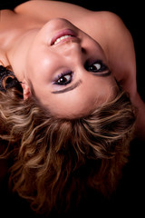 Fototapeta premium Beautiful and happy blond girl leaning back to the camera