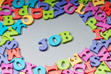 Employment concept with letters on background