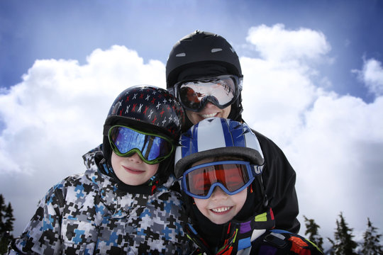 mother with two boys skiing