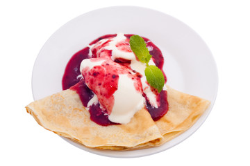 Crepe with ice cream and berry topping. Isolated, clipping path.