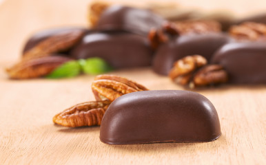 Chocolate candies filled with pecan nut