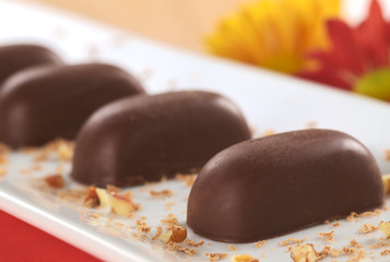 Chocolate candies filled with pecan nut