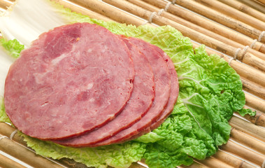 Beautiful sliced food arrangement of meat.