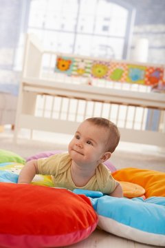 Happy infant on playmat