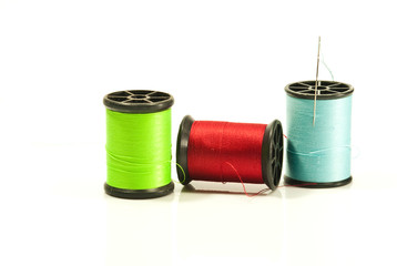 spools of thread on white background