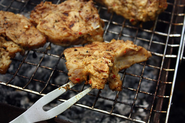 close-up turn over t-bone steak on the grill