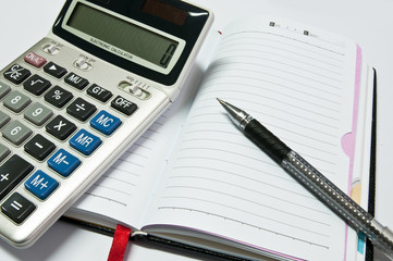 the electronic calculator, notebook, pen