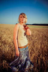 Image of young woman on wheat field