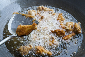 Batter-fried chicken in spade of frying