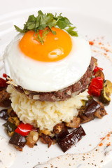beef burger with egg and potatoes