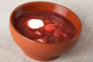 Borsch in a brown ceramic plate