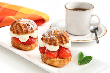 Strawberry cakes and cup of coffee
