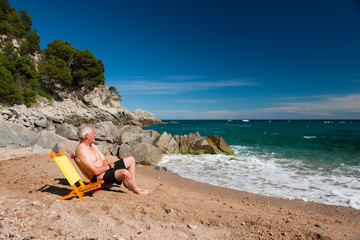 Elderly man at the beach