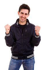 Fototapeta premium Portrait of an excited young man with hands raised in victory ag