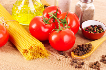 Pasta spaghetti with tomatoes, olive oil, peper  and basil on a