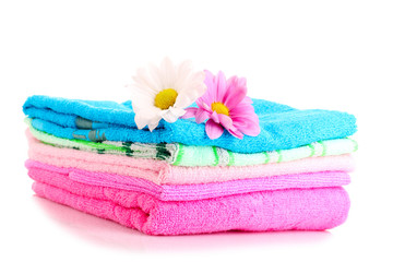 Obraz na płótnie Canvas stacked colorful towels on a white background