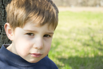 Portrait of the adorable little boy outside