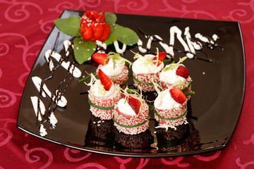 Tiramisu Sushi Roll garnished with Strawberry and Mint
