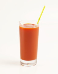 Fresh tomatoes and a glass full of tomato juice on white
