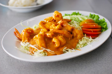 fried shrimp with orange sauce and vegetables