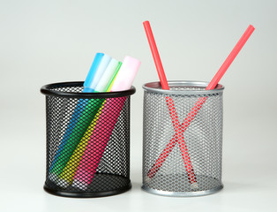 Markers and pencils in supports