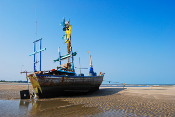 fisherman boat on the sea shore