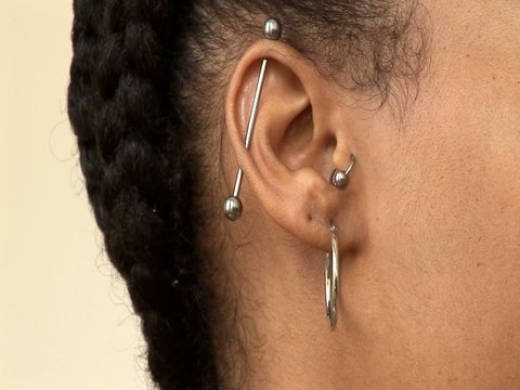Pierced ear on African American woman